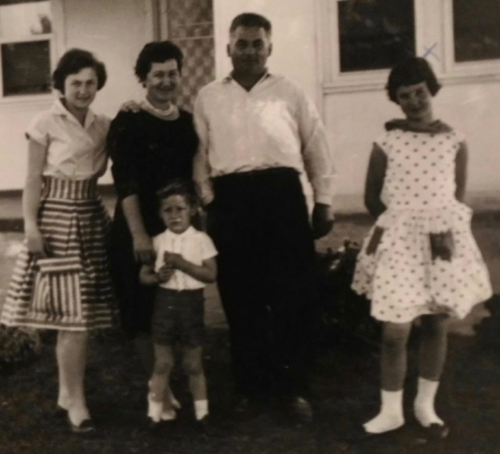 Zampin family, outside family home, c 1962